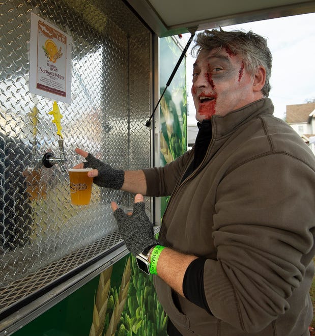 Tom Hurd of Rehoboth services Dogfish Head beer at Milton Zombie Fest.