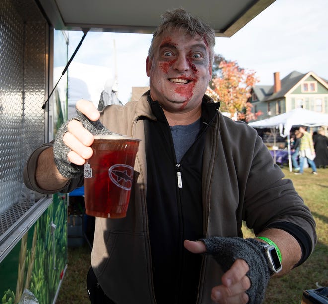 Tom Hurd of Rehoboth services Dogfish Head beer at Milton Zombie Fest.