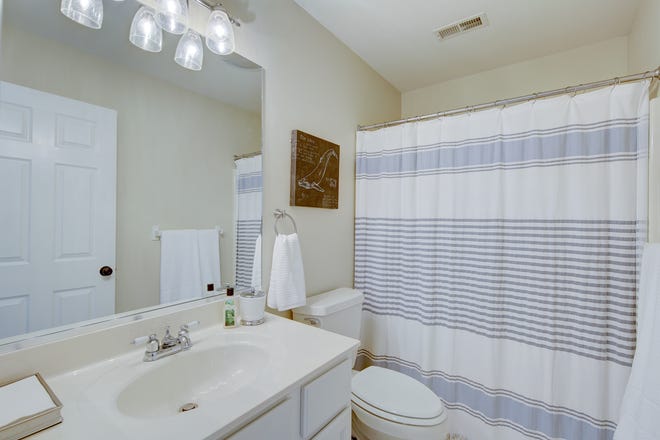 The house at 204 Lakeview Shores features four full bathrooms and two half baths.