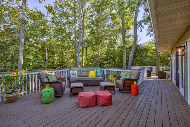 The rear deck at 204 Lakeview Shores in Rehoboth Beach overlooks a pond.