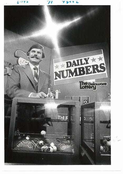 Ted Bowman, deputy director of sales for the Delaware State Lottery, with the lottery's number machines in 1978.