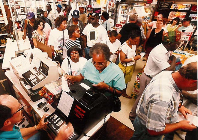 Maggie Fleming of Chester, Pennsylvania, buys a Powerball ticket at Naamans Beverage Mart in 1993.