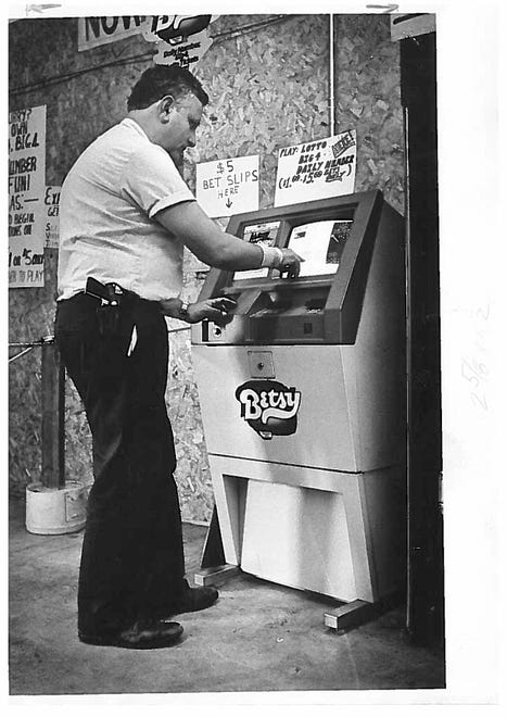 Dick Gropper checks out a new self-service lottery machine at Brewers Outlet on Concord Pike in 1985.