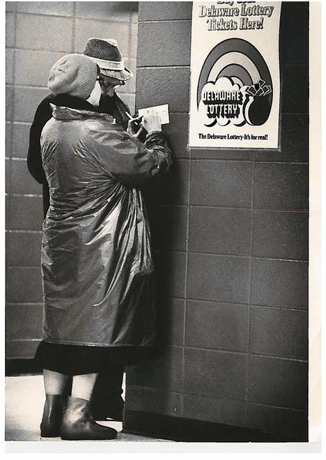 A woman fills out a lottery ticket in the Brandywine business in 1975.
