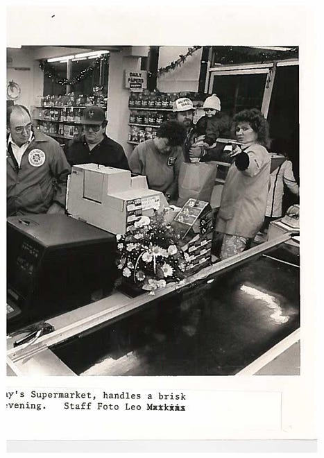 Charlie Richardson, a clerk at Johnny's Supermarket, sells lottery tickets in 1988.