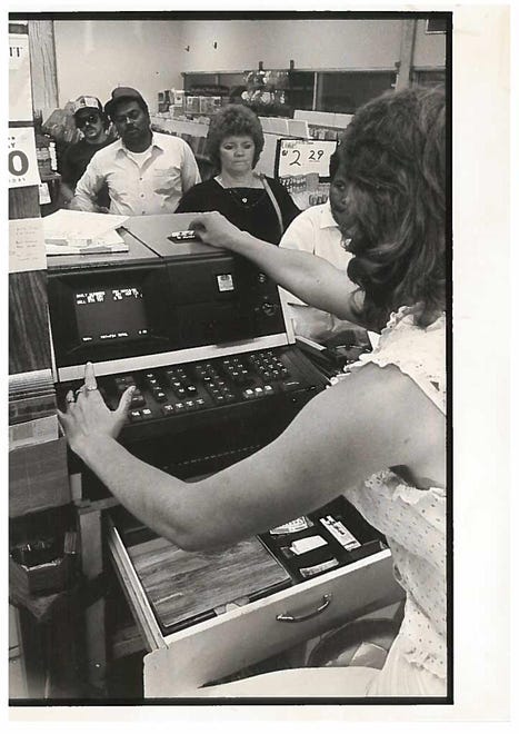 Edna Gilbert leads a line of people waiting to play Delaware Lottery at Brookside News Center in 1985.