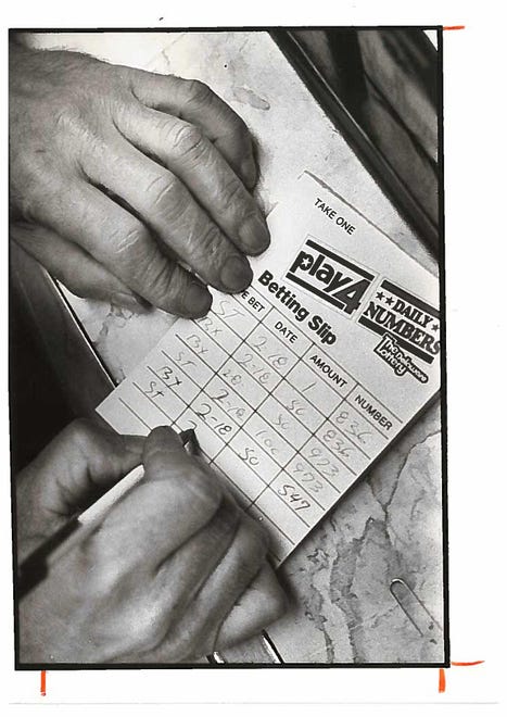 Filling out a weekly betting slip for Delaware Lottery in 1985.