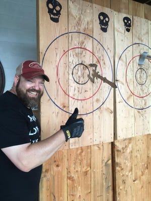 Battle Axe owner Mike Evans at a past ax-throwing event at the Wilmington-area Liquid Alchemy Beverages meadery.