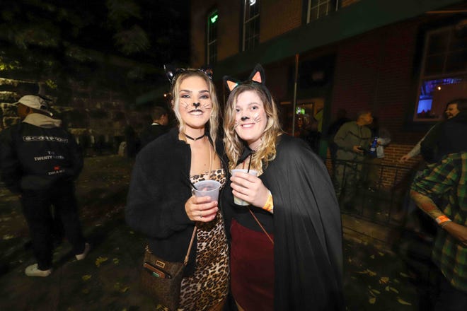 Patrons pose for a photo during the annual Trolley Square Halloween Loop Saturday, Oct. 27, 2018, at Kelly's Logan House in Wilmington.