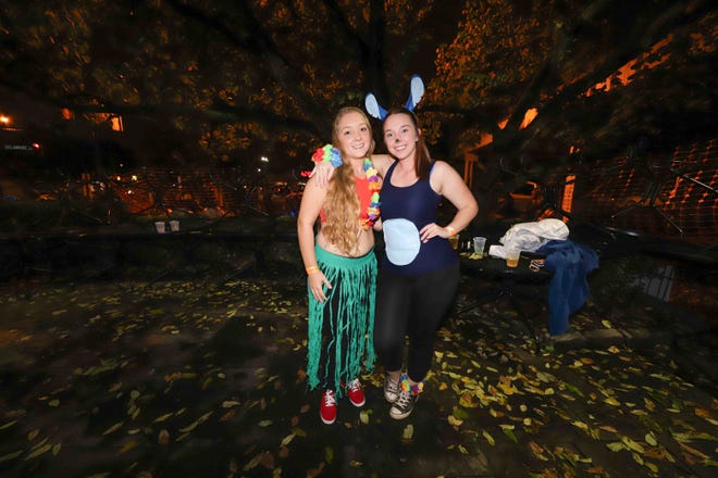 Patrons pose for a photo during the annual Halloween Loop Saturday, Oct. 27, 2018, in Wilmington.