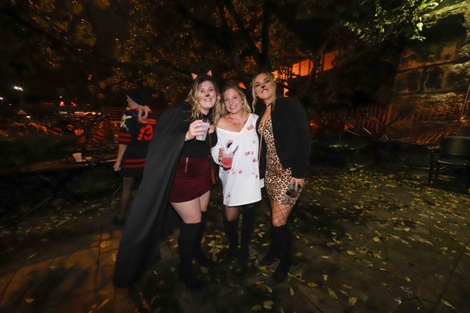 Patrons pose for a photo during the annual Trolley Square Halloween Loop Saturday, Oct. 27, 2018, at Kelly's Logan House in Wilmington.