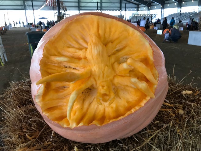This pumpkin carved by The DE Stars offers a 3D spider reaching out of of the carving at the Great Delaware Pumpkin Carve Oct. 26-27 at the Delaware State Fair fairgrounds.