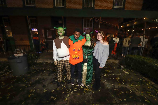 Patrons pose for a photo during the annual Halloween Loop Saturday, Oct. 27, 2018, at Kelly ' s Logan House in Wilmington.