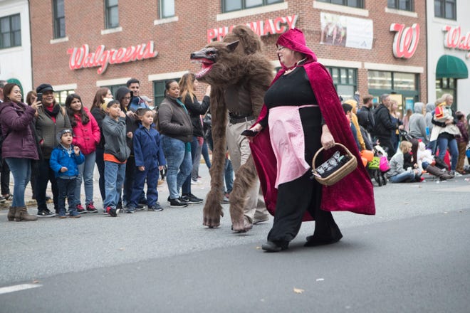 Parade goers enjoy the Newark Halloween Parade Sunday afternoon on Main Street in Newark.
