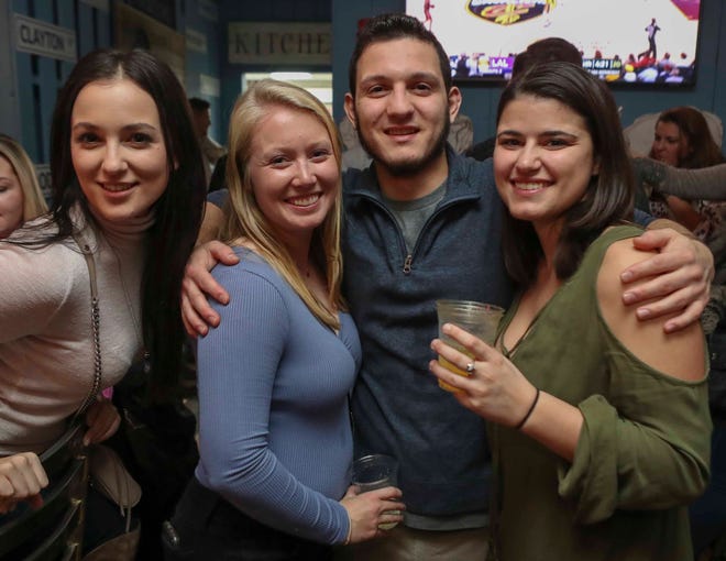 Patrons hit the Trolley Square Oyster House during Thanksgiving-Eve revelry in Wilmington   Wednesday.