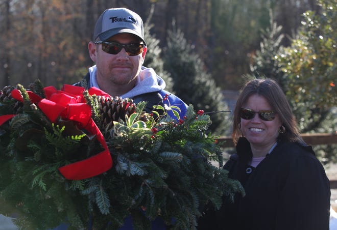 Herb and Bobbyjo Geissler of Newark leave Willey Farms with a Christmas wreath Friday morning.