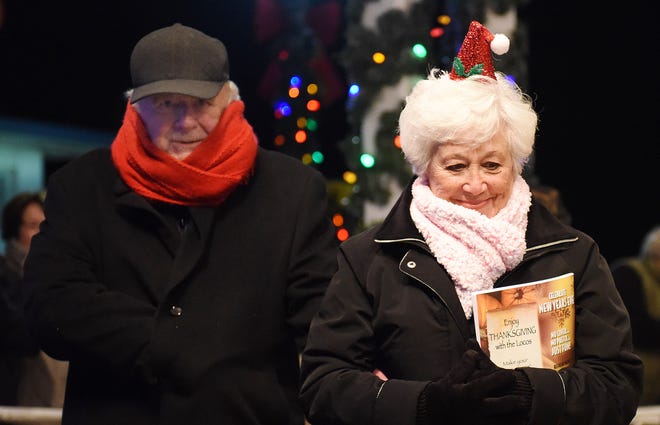 Under a full moon, several thousand visitors came out in the cold to sing Christmas carols and light Rehoboth Beach's Christmas tree on Friday night in downtown Rehoboth Beach. Clear Space Theater provided the musical selections as the tree donated by Pat and Paul Romaine was decorated with hundreds of lights.