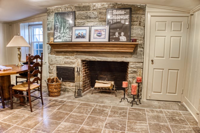 This stone fireplace is in the basement family room at 2 Alapocas Drive.