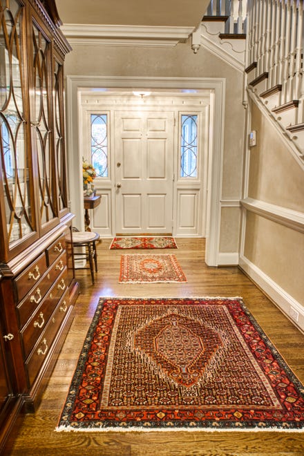 The grand entry foyer at 2 Alapocas Drive offers a spacious room and the hardwood floors that run throughout the house.