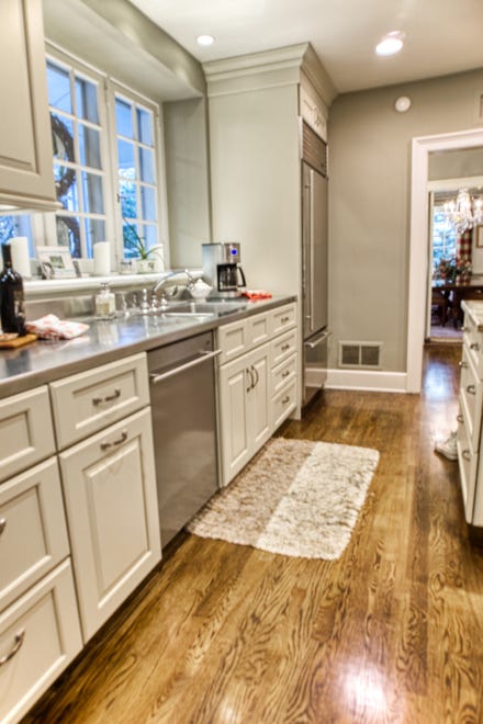 The kitchen at 2 Alapocas Drive features granite countertopos and stainless steel appliances.