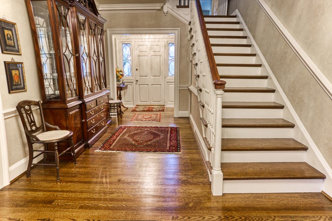 The foyer at 2 Alapocas Drive offers a spacious entrance into the x,xxx-square-foot home.