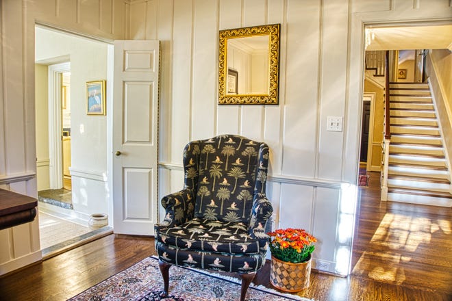 The den at 2 Alapocas Drive is right off the entry foyer and features the original millwork and cabinetry.