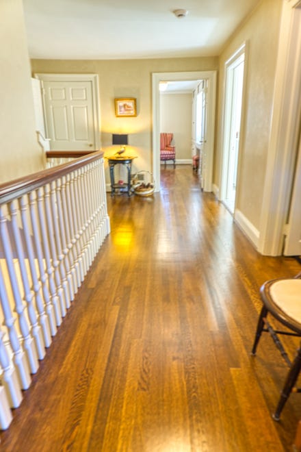 Hardwood floors in the hallsways connect the rooms upstairs at 2 Alapocas Drive