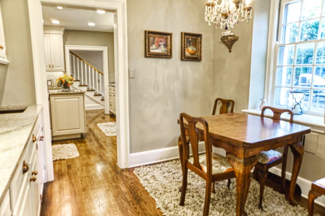 A breakfast nook across from the butler's pantry at 2 Alapocas Drive connects the kitchen and dining room.