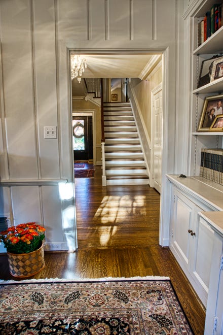 The den at 2 Alapocas Drive is right off the entry foyer and features the original millwork and cabinetry.