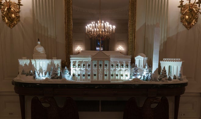 The gingerbread house, showcasing the full expanse of the National Mall: the Capitol, the Lincoln Memorial, the Jefferson Memorial, the Washington Monument, and, the White House is seen in the State Dining Room at the White House.