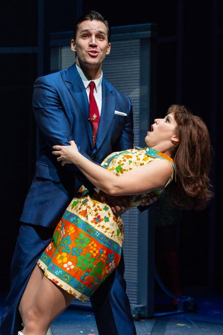 Brian (Ryan Silverman) catches job hunter Cindy (Chilina Kennedy) when she falls into his arms in Delaware Theatre Co.'s 'A Sign of The Times.'