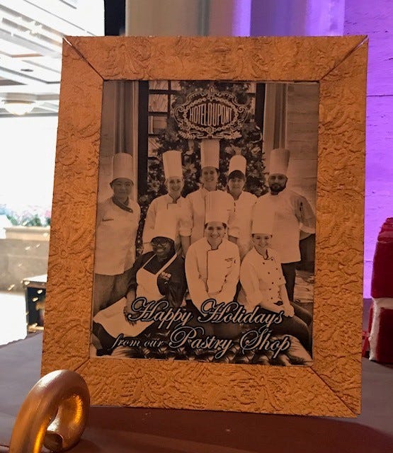 A photo of the pastry team sits on the mantle of the edible display.