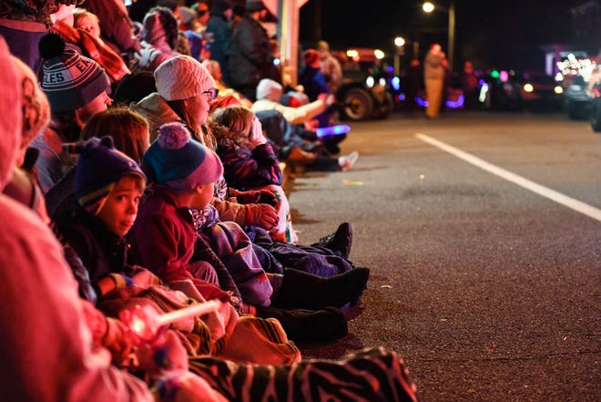 A crowd gathers to watch the Georgetown Christmas Parade on Thursday, Dec 6, 2018.
