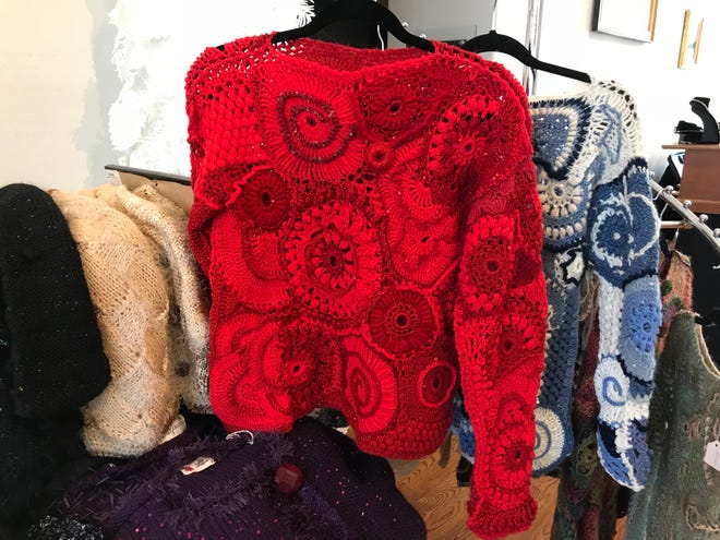Irina's Originals offer spectacular hand-knitted sweaters made with bead-studded Russian yarn, Shawls and capes made with felted wool edging; and complex, one-of-a-kind sweaters like this red one. irinasoriginals.com