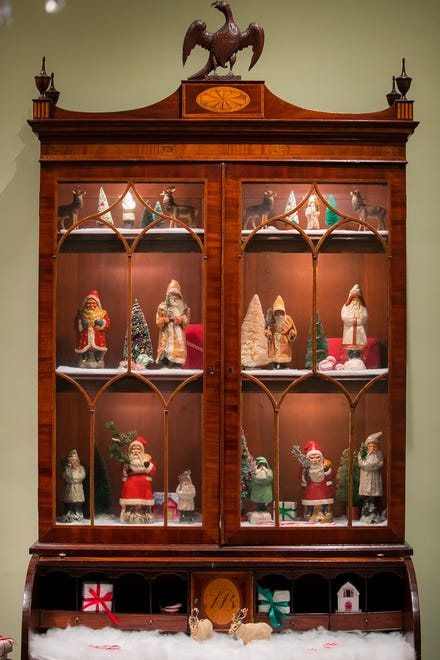 Statues of Santa Claus are scattered throughout Yuletide at Winterthur estate. The tour closes Jan. 6.
