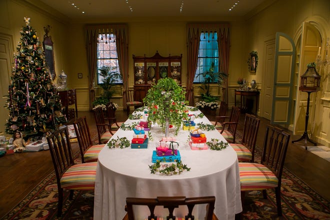 Guests can tour the Yuletide at Winterthur through Jan. 6. The dining room decor has presents stacked at each place as well as under the tree.
