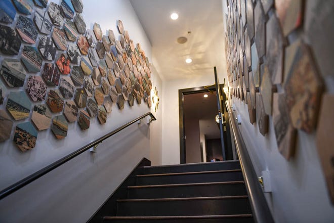A creative artwork display of local photos decorates the stairwell at new Rehoboth Beach restaurant The Pines on Tuesday, Dec 11, 2018. The modern tavern aims to infuse classic dishes with creative, locally sourced ingredients.