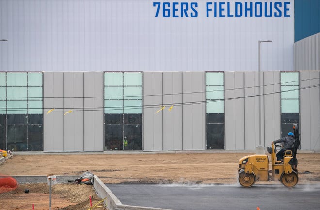 Paving of the parking lot area continues as construction delays have pushed the Delaware Blue CoatsÕ opening game in the new 76ers Fieldhouse to Jan. 23.