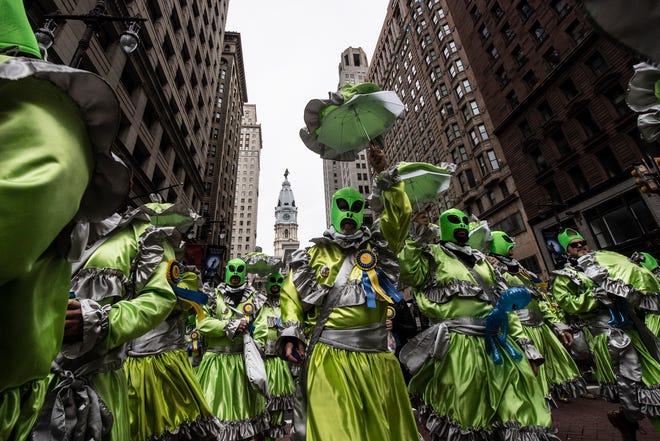 Members of the Murray Comics, the Mollywoppers, struts down Broad Street during the Mummers Parade, Tuesday, Jan. 1, 2019, in Philadelphia. (David Maialetti/The Philadelphia Inquirer via AP)