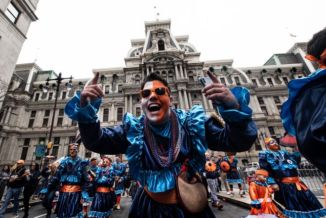 Members of The Holy Rollers N.Y.B., struts down Broad Street during the Mummers Parade, Tuesday, Jan. 1, 2019, in Philadelphia. (David Maialetti/The Philadelphia Inquirer via AP)