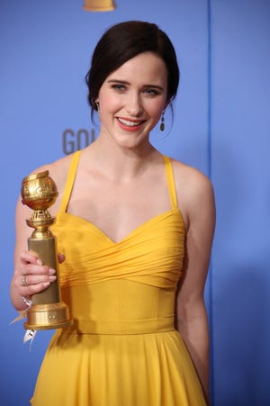 Rachel Brosnahan holds up the Golden Globe she won Sunday for Amazon's "The Marvelous Mrs. Maisel."