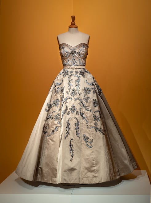Michele Clapton's champagne dress was designed to highlight the difference in the roles of Princess Margaret and Queen Elizabeth.