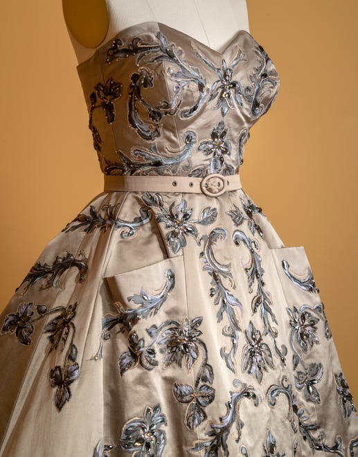 Michele Clapton's champagne dress was designed to highlight the difference in the roles of Princess Margaret and Queen Elizabeth.