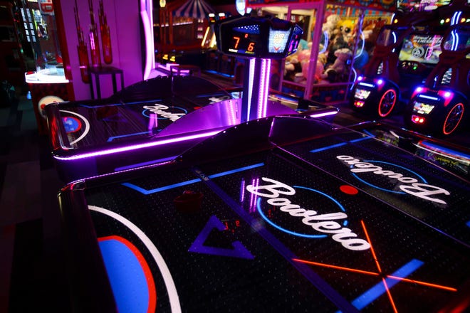 The reinvigorated Bowlero - formerly the AMF Price Lanes - features retro-surfer styling, video panels and blacklight lanes.