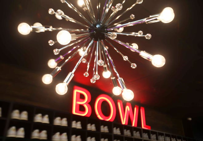 The reinvigorated Bowlero - formerly the AMF Price Lanes - features retro-surfer styling, video panels and blacklight lanes