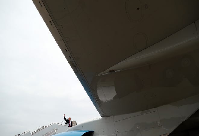 President Donald Trump boards Air Force One at Andrews Air Force Base, Md., Saturday, Jan. 19, 2019, to travel to Dover Air Force Base, Del. (AP Photo/Andrew Harnik)