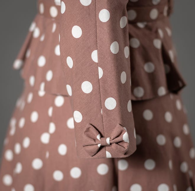 Michele Clapton designed this polka-dotted suit for Claire Foy's Princess Elizabeth to wear while visiting Kenya in 1952 in 'The Crown.'