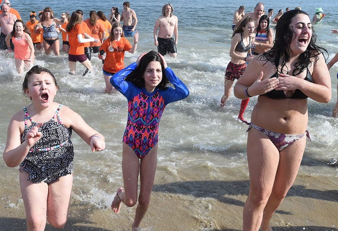Warmer temperatures had over 3000 "Bears" making the jump into the Atlantic Ocean on Sunday for the Annual Lewes Polar Bear Plunge for Special Olympics Delaware on the beach at Rehoboth Beach. 
Special to the News Journal / CHUCK SNYDER