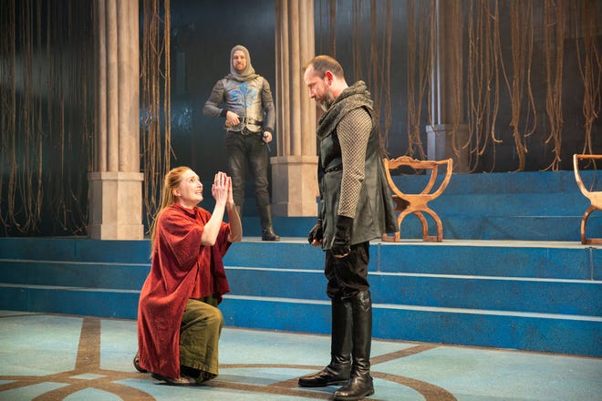 Clare O'Malley, left, plays Joan of Arc in  "St. Joan" at Delaware Theatre Company with Sean Michael Bradley, center, and Charlie DelMarcelle.