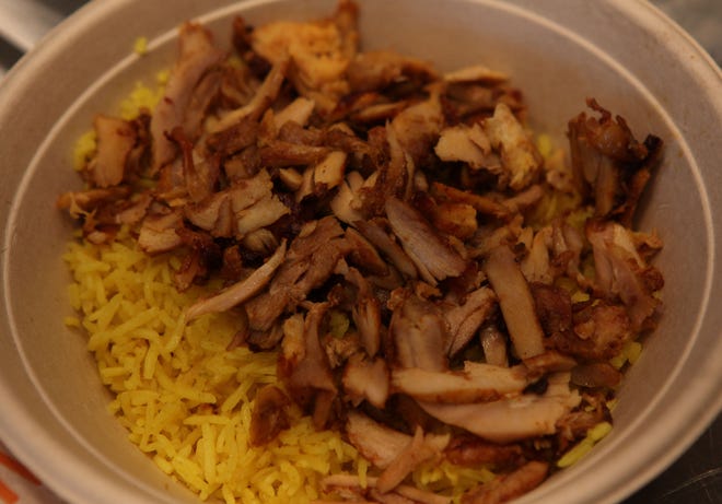A chicken rice bowl prepared Tuesday afternoon at Naf Naf Grill in Stanton.  The Middle Eastern-themed casual restaurant officially opens Wednesday.